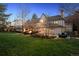 Spacious backyard with a stone patio, outdoor seating, fire pit and lush lawn for outdoor entertainment at 6375 E Tufts Ave, Englewood, CO 80111