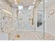 This updated bathroom features skylights, a dual shower, and herringbone tile at 6375 E Tufts Ave, Englewood, CO 80111