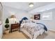 Cozy bedroom with comfortable bed, bedside tables with lamps, and a window at 6375 E Tufts Ave, Englewood, CO 80111
