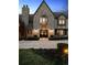 Stunning stone facade and arched entryway highlight this exceptional two-story home at 6375 E Tufts Ave, Englewood, CO 80111
