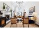 Spacious living room with vaulted ceilings, a fireplace, and comfortable seating, perfect for entertaining at 6375 E Tufts Ave, Englewood, CO 80111