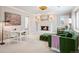 Cozy sitting room offers a fireplace and neutral paint at 6375 E Tufts Ave, Englewood, CO 80111
