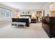 This bedroom suite features plantation shutters, neutral paint and carpet and ensuite bath at 6375 E Tufts Ave, Englewood, CO 80111