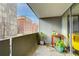 A private condo balcony offers a cozy outdoor retreat with views of the surrounding neighborhood at 909 N Logan St # 3C, Denver, CO 80203