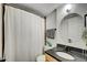 Cozy bathroom with a shower-tub combination and updated fixtures at 909 N Logan St # 3C, Denver, CO 80203