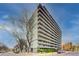 An exterior view of a tall condominium building with multiple stories and balconies at 909 N Logan St # 3C, Denver, CO 80203