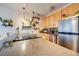 Bright kitchen with modern appliances and cabinetry offers a functional cooking space at 909 N Logan St # 3C, Denver, CO 80203