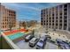 The condo's view overlooks the parking area and nearby cityscape at 909 N Logan St # 3C, Denver, CO 80203