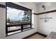 Shower stall featuring a large window with views of the mountains and the hot tub on the balcony at 29095 Summit Ranch Dr, Golden, CO 80401