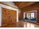 Bedroom with wooden floors, large built-in closet and window seat with view at 29095 Summit Ranch Dr, Golden, CO 80401