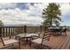 Deck with mountain views featuring an outdoor table and chairs at 29095 Summit Ranch Dr, Golden, CO 80401