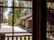 View of detached two-car garage through a window at 29095 Summit Ranch Dr, Golden, CO 80401