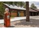 Spacious three-car garage with vintage gas pump, blending modern convenience with rustic charm at 29095 Summit Ranch Dr, Golden, CO 80401