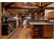 Kitchen boasting wood cabinets, granite countertops, brick backsplash, and an antique oven at 29095 Summit Ranch Dr, Golden, CO 80401