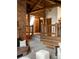 Living room with a mix of brick, carpet, and wooden beams at 29095 Summit Ranch Dr, Golden, CO 80401
