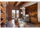 Cozy home office with custom wood features, shelves, and wood-burning fireplace at 29095 Summit Ranch Dr, Golden, CO 80401