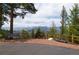 Scenic overlook with mountain views, park bench, and decorative mining artifacts at 29095 Summit Ranch Dr, Golden, CO 80401