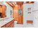 Modern bathroom with granite countertop, a walk-in shower, and wood accents at 608 Patty Dr, Evergreen, CO 80439