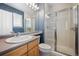 Updated bathroom featuring a glass shower, vanity with sink, and modern lighting at 1635 N Franklin St, Denver, CO 80218