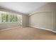Bedroom featuring a large window and neutral-toned carpet at 1635 N Franklin St, Denver, CO 80218