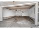 Clean and spacious attached garage with overhead lighting and ample storage space at 1635 N Franklin St, Denver, CO 80218