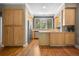 Well-lit kitchen with wood cabinets, stainless steel appliances, and view of the backyard at 1635 N Franklin St, Denver, CO 80218