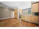 Bright kitchen with wood cabinets, stainless steel appliances, and hardwood flooring at 1635 N Franklin St, Denver, CO 80218