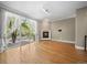 Bright living room featuring hardwood floors, fireplace, and balcony access with natural light at 1635 N Franklin St, Denver, CO 80218