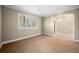 Neutral room featuring a window letting in natural light and neutral paint at 1635 N Franklin St, Denver, CO 80218
