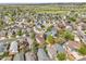 Panoramic aerial view of a residential neighborhood showcasing diverse housing options, green spaces, and tree-lined streets at 16928 Dandelion Way, Parker, CO 80134