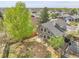 Aerial view of the backyard with mature trees, partial fencing and patio, offering privacy and space at 16928 Dandelion Way, Parker, CO 80134
