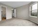 Neutral Primary bedroom with plush carpet, and a view of the outdoors at 16928 Dandelion Way, Parker, CO 80134