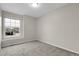 Bedroom featuring neutral walls, carpet flooring, and a bright window at 16928 Dandelion Way, Parker, CO 80134