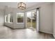 Dining room with large windows and sliding glass door that overlook the backyard at 16928 Dandelion Way, Parker, CO 80134