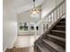 Welcoming foyer with high ceilings and a staircase leading to the upper level at 16928 Dandelion Way, Parker, CO 80134