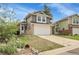 Charming two-story home features a two-car garage and nicely landscaped front yard with beautiful curb appeal at 16928 Dandelion Way, Parker, CO 80134