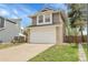 Attractive home featuring a two-car garage, neutral paint, lawn, and a convenient driveway at 16928 Dandelion Way, Parker, CO 80134