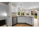 Kitchen peninsula featuring granite countertops, stainless steel appliances and backyard view at 16928 Dandelion Way, Parker, CO 80134