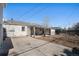 A fenced-in backyard featuring a covered patio and a concrete area at 1940 E 95Th Ave, Thornton, CO 80229