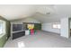 Large bonus room with sloped ceilings and ample space for play or relaxation featuring great natural light at 1940 E 95Th Ave, Thornton, CO 80229