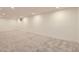 Finished basement with neutral carpet providing a versatile and comfortable space for various activities at 4475 S Routt St, Littleton, CO 80127