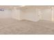 Spacious basement featuring neutral carpet and a white painted wall finish at 4475 S Routt St, Littleton, CO 80127