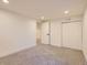 Finished basement featuring carpet and doors at 4475 S Routt St, Littleton, CO 80127