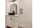 Stylish bathroom with a modern vanity and square mirror showcasing sleek design and functionality at 4475 S Routt St, Littleton, CO 80127