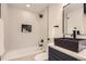 Beautiful bathroom featuring matte black fixtures, vanity, and showerhead at 4475 S Routt St, Littleton, CO 80127