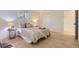Serene bedroom with a comfortable bed, stylish lamps, and a bright window at 4475 S Routt St, Littleton, CO 80127