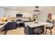 Modern kitchen with white cabinets, stainless steel appliances, and a kitchen island with seating at 4475 S Routt St, Littleton, CO 80127