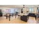 Open-concept kitchen with island seating, modern lighting, and stainless steel appliances at 4475 S Routt St, Littleton, CO 80127