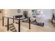 Bright living room featuring a modern fireplace, neutral furnishings, and large windows at 4475 S Routt St, Littleton, CO 80127