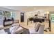 View of the living room with an open layout, stylish seating, and easy access to the modern kitchen at 4475 S Routt St, Littleton, CO 80127